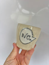 Load image into Gallery viewer, Hand holding a small ceramic cup with 'No.' written on it against a white background
